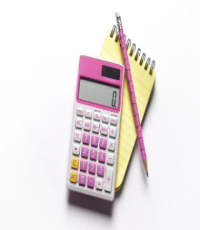 Calculator with a pen and notepad