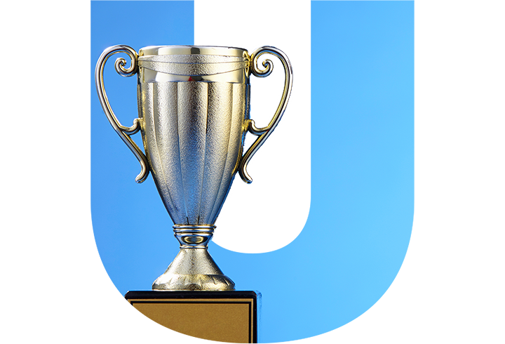 Winner cup over a blue U