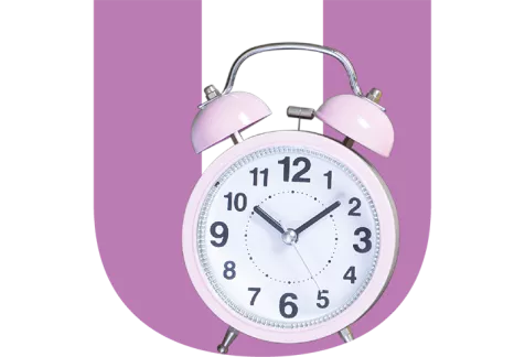 Pink alarm clock over a Purple U