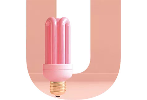 Pink modern light bulb over a pink U