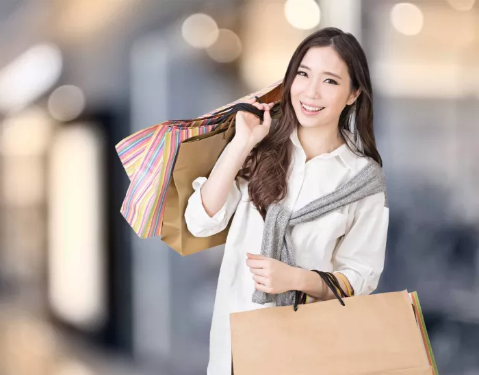 Smiling woman holding shopping bags