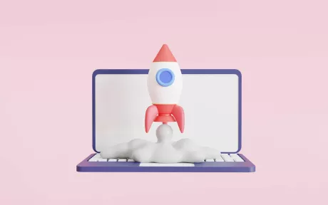 Laptop with a rocket taking off